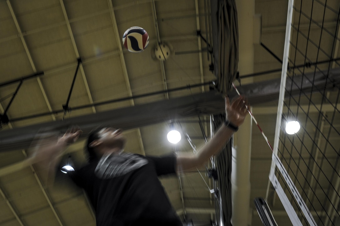 Capt. Karl Grosselin, the coach of the Air Force men’s volleyball team, serves a volleyball during practice at Hurlburt Field, Fla., May 23, 2017. Grosselin is assigned to the Space Superiority Directorate at Los Angeles Air Force Base, Calif. (U.S. Air Force photo by Airman 1st Class Dennis Spain)