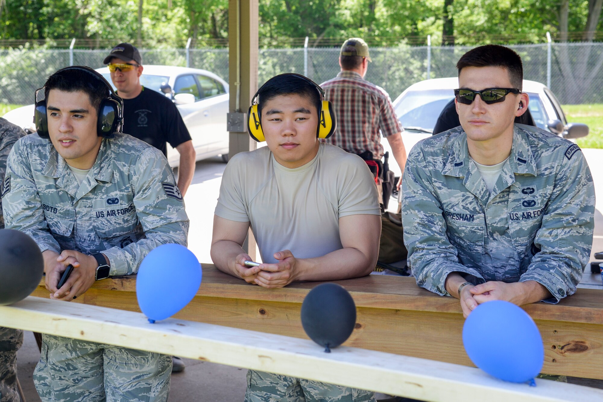 Staff Sgt. Jose Soto, Airman 1st Class Jordan Basilicato, and 1st Lt. Christopher Gresham of the 375th Security Forces Squadron watch as participants of the Police Week Shooting Competition compete at the O’Fallon and Fairview Heights Police Department Range May 15, 2017. Members from both military and civilian law enforcement tested their shooting skills at the firing range. (U.S. Air Force photo by Airman Chad Gorecki)