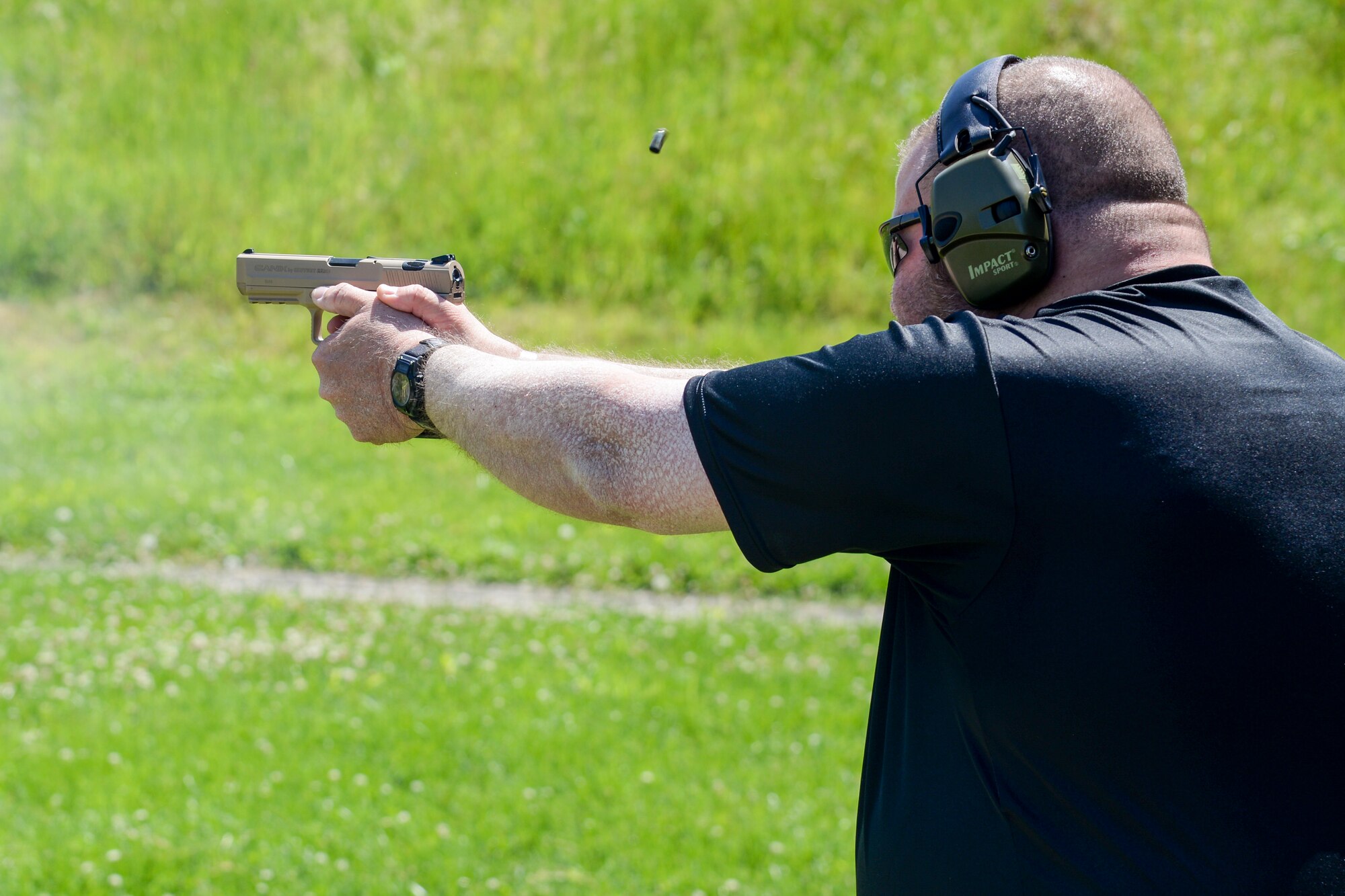 Randy Smith of the 375th Security Forces Squadron fires a round during the Police Week Shooting Competition at the O’Fallon and Fairview Heights Police Department Range May 15, 2017. The event was held as a part of National Police Week and brought law enforcers from both the military and civilian side together.(U.S. Air Force photo by Airman Chad Gorecki)
