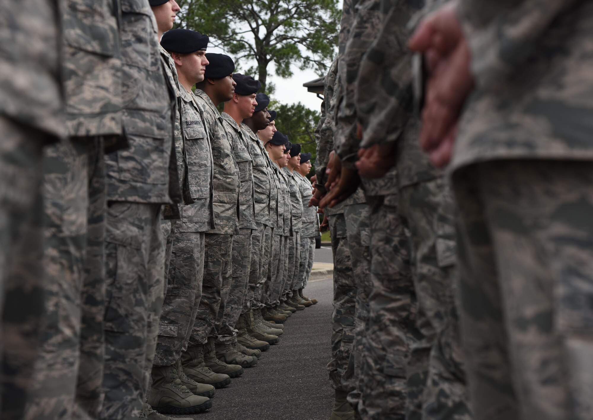 Members of the 81st Security Forces Squadron stand in formation during the 81st SFS retreat ceremony May 18, 2017, on Keesler Air Force Base, Miss. The event was held during National Police Week, which recognizes the service of law enforcement men and women who put their lives at risk every day. (U.S. Air Force photo by Kemberly Groue)