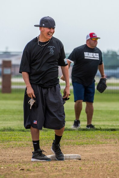 Scott's military police and first responders, along with law enforcement members from the surrounding communites, gathered together to play softball May 17 at Scott Air Force Base, Illinois. The gathering of everyone helped boost the comroderie with the base and local law enforcement. (U.S. Air Force photos/ Senior Airman Tristin English)