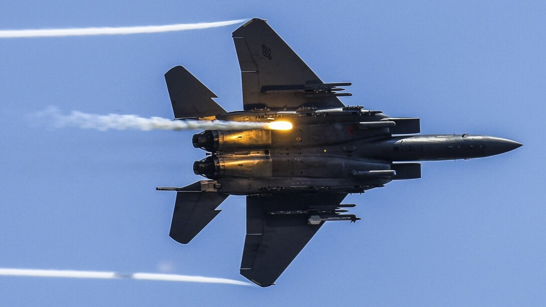 An F-15E Strike Eagle releases flares as part of a combined arms demonstration during the Wings Over Wayne Air Show at Seymour Johnson Air Force Base, N.C., May 21, 2017. The demonstration showcased the Strike Eagle's air-to-air and air-to-ground capabilities. Air Force photo by Staff Sgt. Brittain Crolley