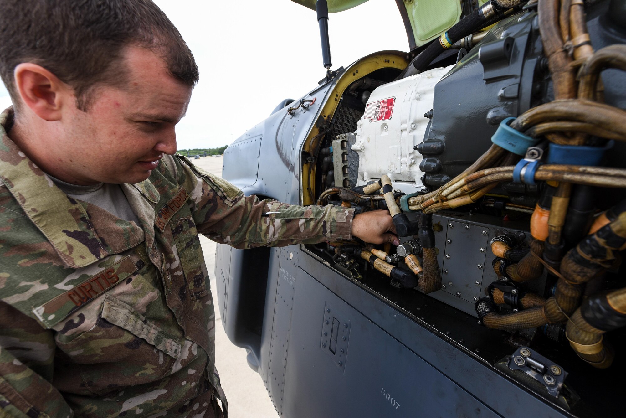 Staff Sgt. John Curtis, an electrical environmental specialist with the Florida Air National Guard Detachment 2, inspects a CV-22 Osprey at Hurlburt Field, Fla., May 24, 2017. The FLANG Det 2 employs officers and enlisted personnel in maintenance and aircrew positions to aid the 8th Special Operations Squadron and the 801st Special Operations Aircraft Maintenance Squadron. (U.S. Air Force photo by Staff Sgt. Jeff Parkinson)