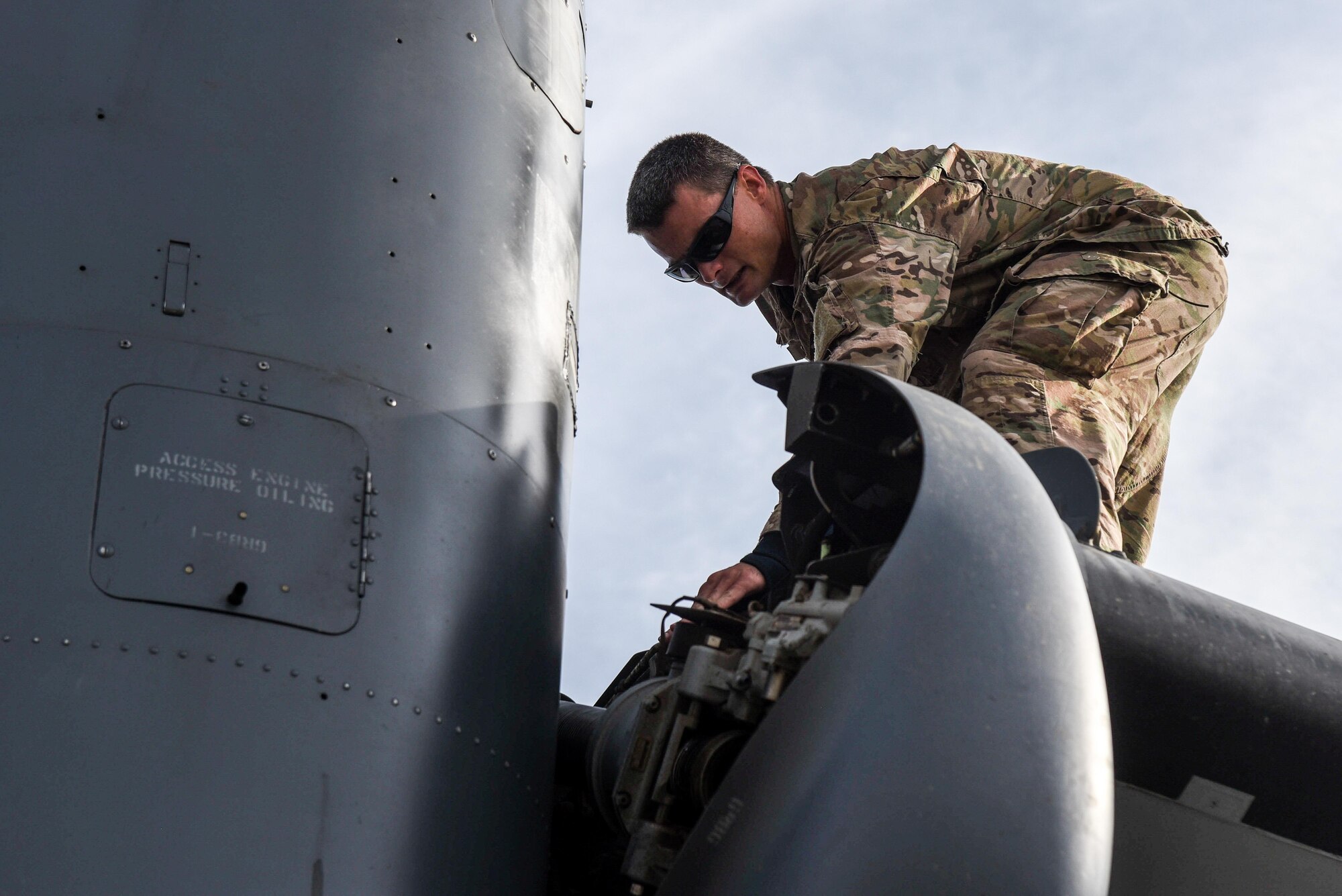 Tech. Sgt. Jeremy Adams, a CV-22 Osprey crew chief with the Florida Air National Guard Detachment 2, inspects a CV-22 at Hurlburt Field, Fla., May 24, 2017. The FLANG Det 2 supports the 1st Special Operations Wing’s CV-22 mission by supporting in maintenance and aircrew roles. (U.S. Air Force photo by Staff Sgt. Jeff Parkinson)