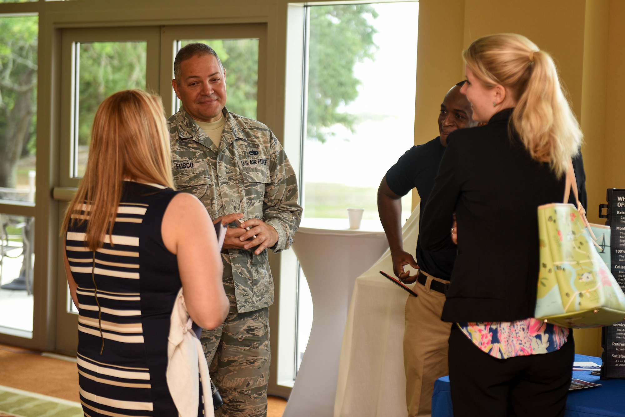 Master Sgt. John Fusco, an in-service recruiter assigned to the 1st Special Operations Force Support Squadron, meets with potential candidates during the 2017 Career Symposium at the Soundside Club, Hurlburt Field, Fla., May 24, 2017. In-service recruiters are career counselors who meet with Airmen separating from active duty and offer opportunities within the Air force Reserves (U.S. Air Force photo by Staff Sgt. Jeff Parkinson)