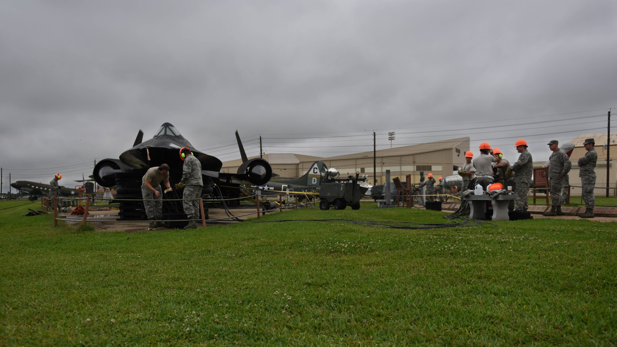 Members of 2nd Maintenance Group prepare to lift a static SR-71 Blackbird at the Global Air Power Museum at Barksdale Air Force Base, La. May 23, 2017. The 2nd Maintenance Squadron Repair and Reclamation Section was in charge the lift with assistance from various shops from the group. (U.S. Air Force photo/Airman 1st Class Stuart Bright)