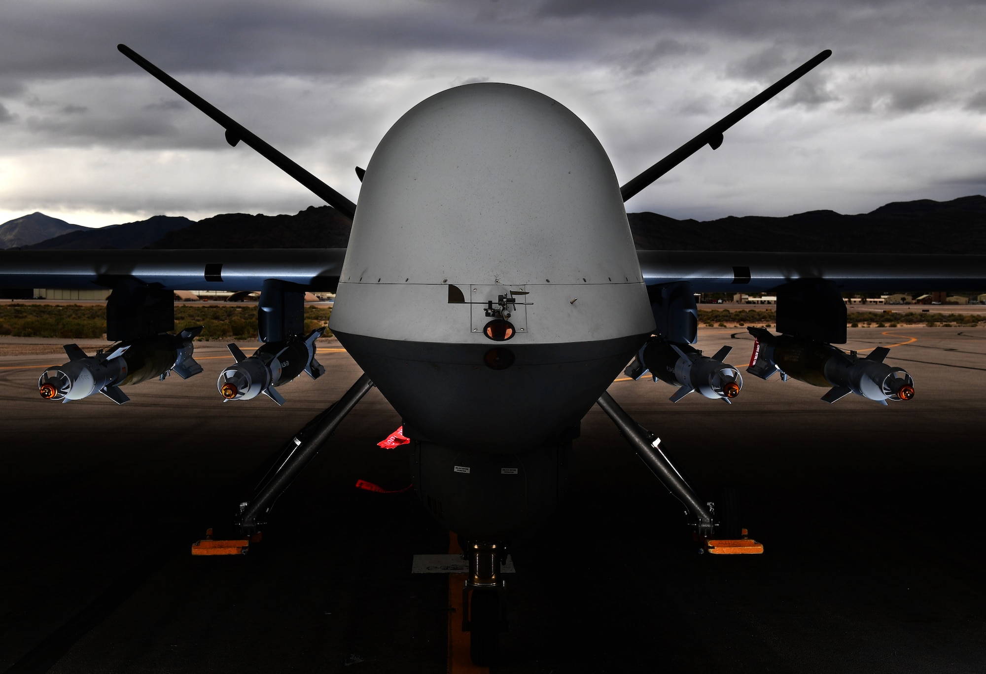 An MQ-9 Reaper, loaded with four GBU-12 Paveway II laser-guided bombs is ready for a training mission March 31, 2017, at Creech Air Force Base, Nev. The MQ-9, matched with a skilled aircrew, provides persistent attack and reconnaissance capabilities 24/7/365. (U.S. Air Force photo/Senior Airman Christian Clausen)