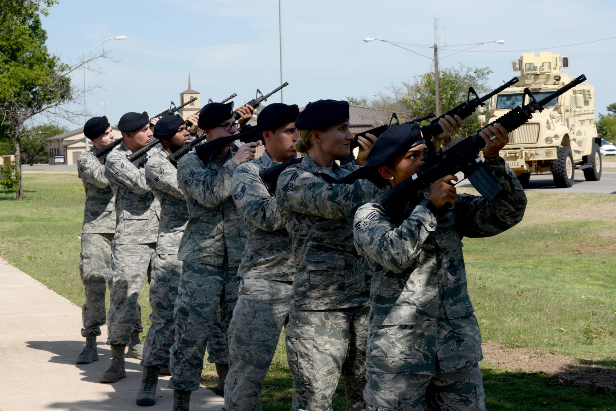 The 97th Security Forces Squadron preform a 21 Guns Salute at reveille during Police Officer Memorial Day, the first day of Police Week, May 15, 2017, at Altus Air Force Base, Oklahoma. This is the 10th year that Altus AFB has hosted events to celebrate Police Week, honoring those who have lost their lives in the line of duty. (U.S. Air Force photo by Airman 1st Class Cody Dowell/released)