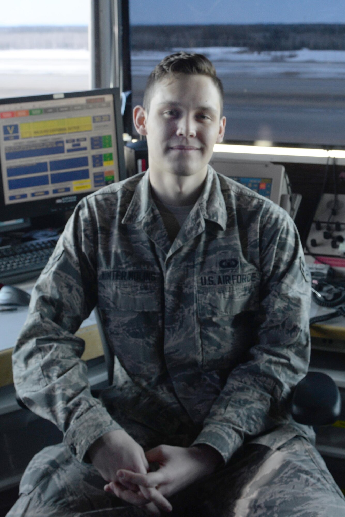 U.S. Air Force Airman 1st Class Kevin Winter-Molins, a 354th Operations Support Squadron air traffic controller, poses for a photo April 20, 2017, at Eielson Air Force Base, Alaska. Winter-Molins enjoys going outdoors to hike during his spare time and also plays the guitar. (U.S. Air Force photo by Airman Eric M. Fisher)