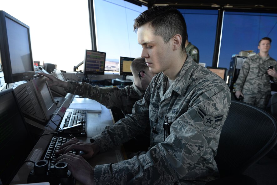 U.S. Air Force Airman 1st Class Kevin Winter-Molins, a 354th Operations Support Squadron air traffic controller, types commands into a computer April 20, 2017, at Eielson Air Force Base, Alaska. Winter-Molins was born in Mexico before moving to the U.S. and later joining the Air Force. (U.S. Air Force photo by Airman Eric M. Fisher)