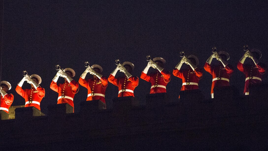 U.S. Marine Drum and Bugle Corps members give a rooftop performance during an evening parade at Marine Barracks Washington, D.C., May 19, 2017. The parades honor senior officials, distinguished citizens and supporters of the Marine Corps. Marine Corps photo by Lance Cpl. Alex A. Quiles