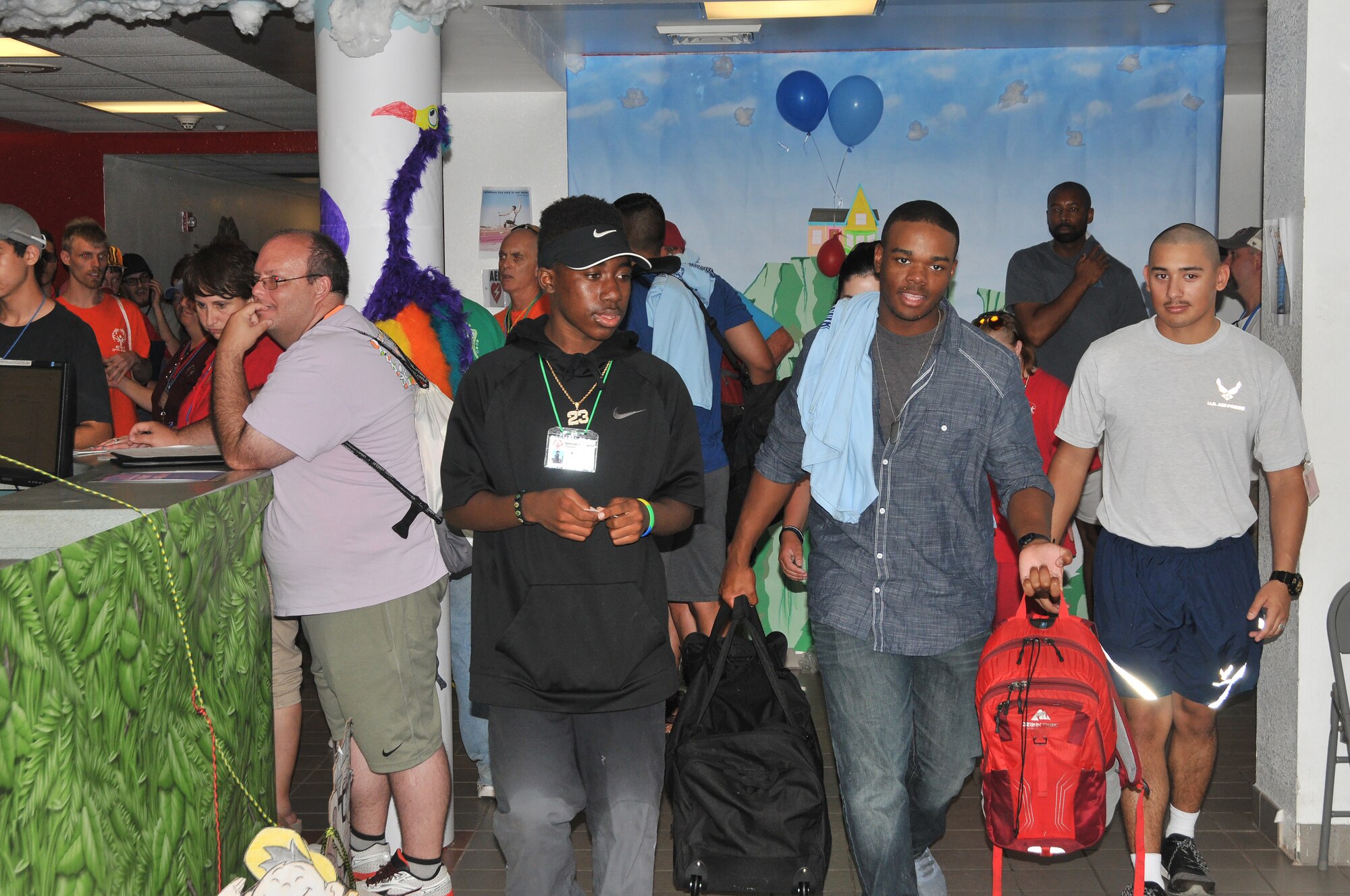 Airman Basic Tyshon Singletary, 335th Training Squadron student, helps Nicholas Berry, Special Olympics athlete, carry his bags upon arrival to Davis Manor for the Special Olympics Mississippi 2017 Summer Games May 19, 2017, on Keesler Air Force Base, Miss. Keesler hosted more than 3,200 athletes, directors, coaches, family members and volunteers spanning over 16 regions across Mississippi for the 31st year. (U.S. Air Force photo by Senior Airman Jenay Randolph)