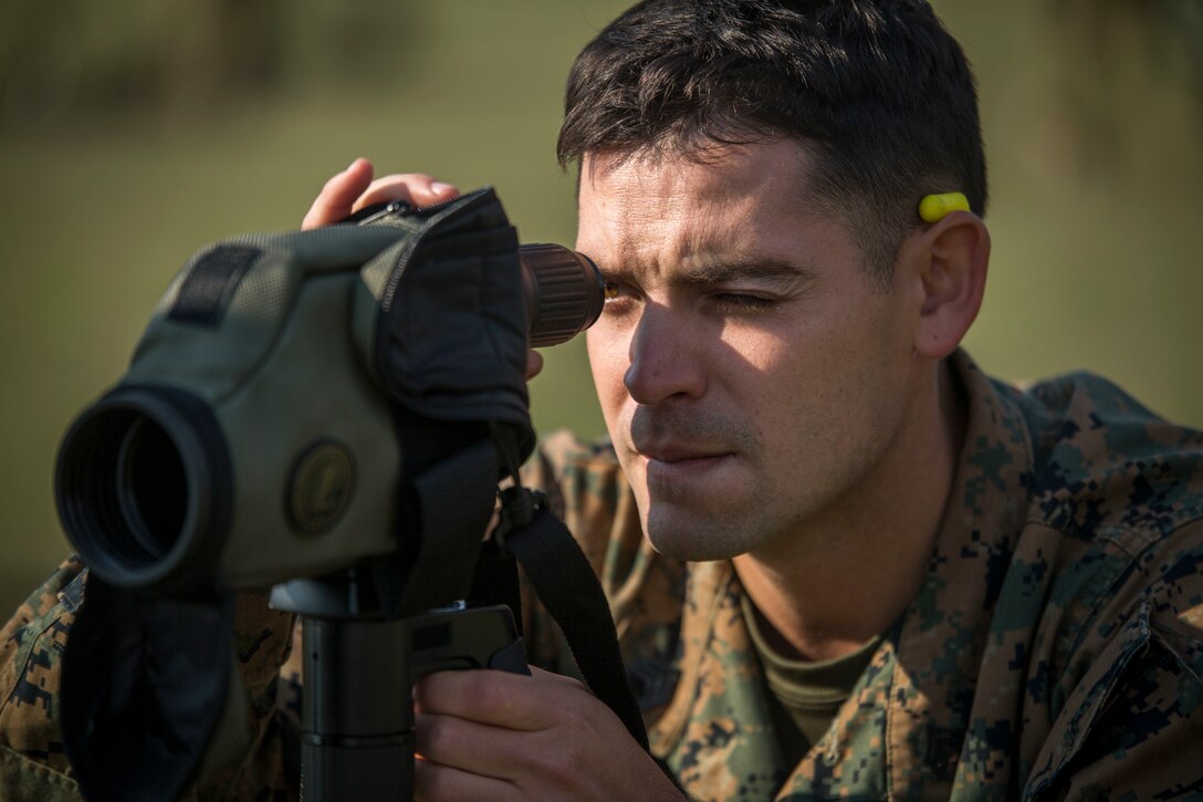 Staff Sgt. Martin Lucero spots for Sgt. Johnathon Solinksy, May 14, 2017, as part of a sniper competition at the Australian Army Skills at Arms Meeting, in Puckapunyal, Australia. The meet, which features matches with the rifle, pistol and machine gun, includes service members from 20 countries. Lucero, a native of Denver, Colorado, is the head coach of the Marine Corps Action Shooting Team, based out of Marine Corps Base Quantico, Virginia. (U.S. Marine Corps photo by Lance Cpl. Bernadette Wildes)