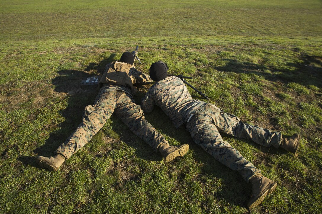 Lance Cpl. Colton Rine (left) and Sgt. Damian Knight (right) focus to find a moving target down range, May 16, 2017, as part of a sniper match during Australian Army Skills at Arms Meeting, in Puckapunyal, Australia. The meet, which brings together 20 countries, features pistol, machine gun, rifle and sniper competitions. Rine, a native of Shippensburg, Pennsylvania, is a rifleman with 3rd Battalion, 4th Marine Regiment. Knight, a native of Saint Augustine, Florida, is a scout with 3rd Bn., 4th Marines. The battalion is deployed to Marine Rotational Force Darwin. (U.S. Marine Corps photo by Lance Cpl. Bernadette Wildes)