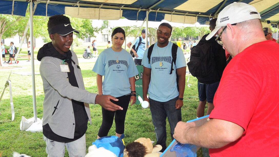 Nicholas Berry, Special Olympics athlete, plays a ball toss game at the Olympic Village during Special Olympics Mississippi 2017 Summer Games May 20, 2017, on Keesler Air Force Base, Miss. Founded in 1968, Special Olympics hosts sporting events around the world for people of all ages with special needs to include more than 700 athletes from Mississippi. (U.S. Air Force photo by Senior Airman Jenay Randolph)