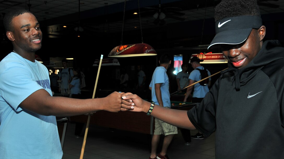 Airman Basic Tyshon Singletary, 335th Training Squadron personnel student, gives Nicholas Berry, Area 11 athlete, a fist bump during the Special Olympics Mississippi 2017 Summer Games May 20, 2017, on Keesler Air Force Base, Miss. Singletary and Berry built a friendship during the two-day event after hanging out and getting to know each other. (U.S. Air Force photo by Senior Airman Jenay Randolph)