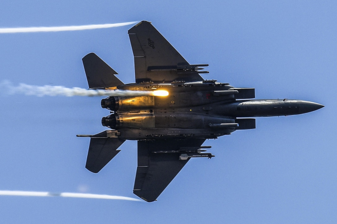 An F-15E Strike Eagle releases flares as part of a combined arms demonstration during the Wings Over Wayne Air Show at Seymour Johnson Air Force Base, N.C., May 21, 2017. The demonstration showcased the Strike Eagle's air-to-air and air-to-ground capabilities. Air Force photo by Staff Sgt. Brittain Crolley