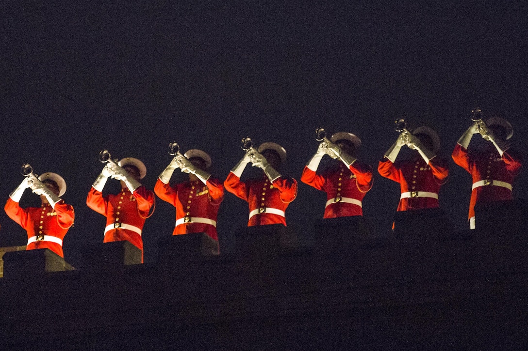 U.S. Marine Drum and Bugle Corps members give a rooftop performance during an evening parade at Marine Barracks Washington, D.C., May 19, 2017. The parades honor senior officials, distinguished citizens and supporters of the Marine Corps. Marine Corps photo by Lance Cpl. Alex A. Quiles