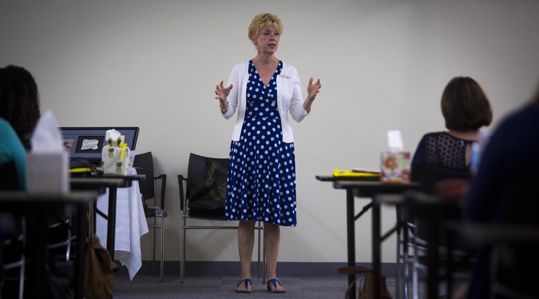Linda Sanborn, wife of Maj. Gen. Russell A. Sanborn, the commanding general of 1st Marine Aircraft Wing, III Marine Expeditionary Force, speaks to military spouses, at Camp Foster, Okinawa, Japan, May 23, 2017, about her experience as the wife of a former prisoner of war. Linda's husband was shot down during Operation Desert Storm in 1991. During her remarks, she described the Marine Corps as a family that will be there during times of need. Sanborn is a native of DeLand, Florida. (U.S. Marine Corps photo by Lance Cpl. Andy Martinez)