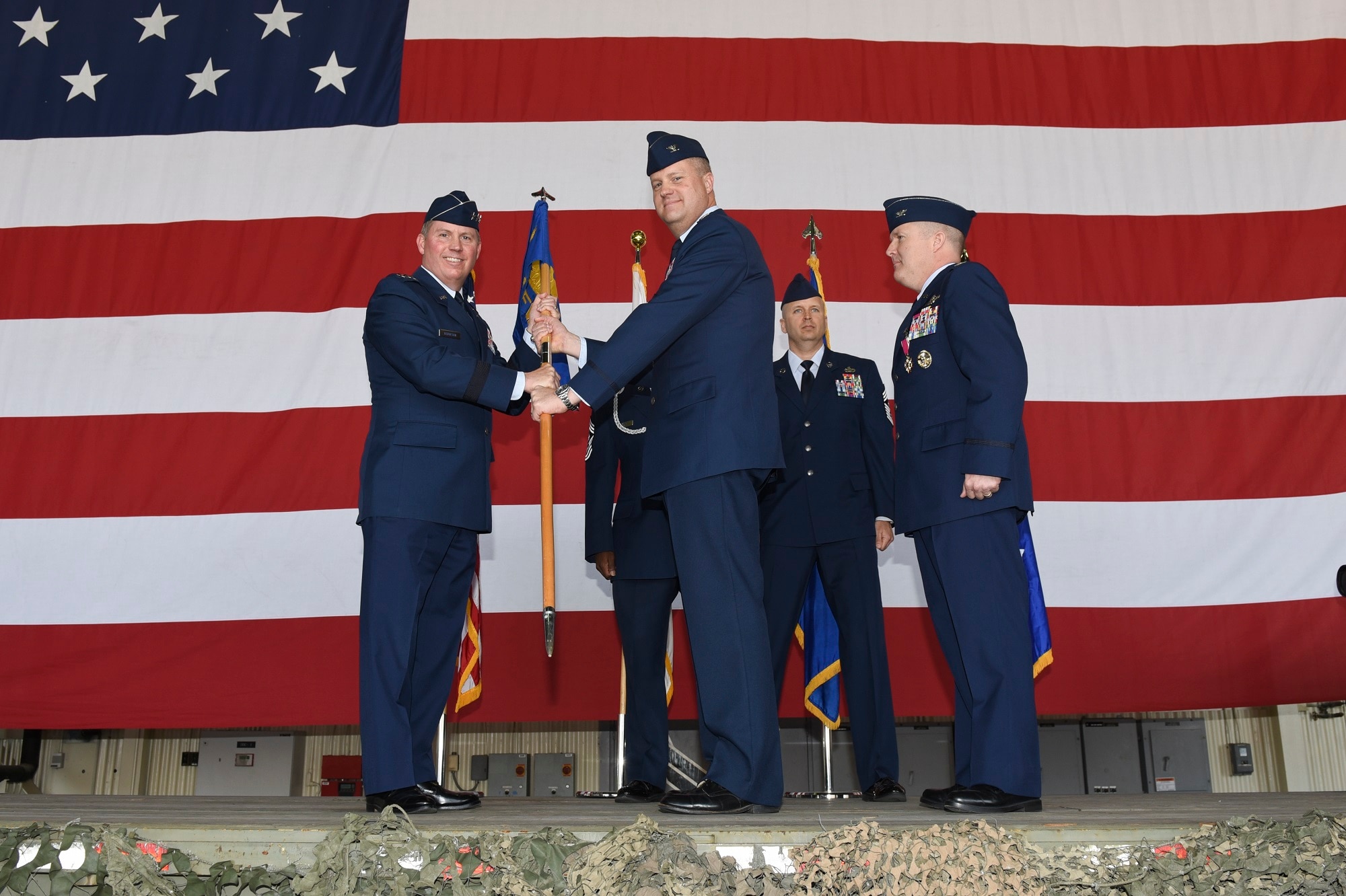 Lt. Gen. Thomas Bergeson, 7th Air Force commander, presents the 8th Fighter Wing guidon to Col. David Shoemaker, 8th Fighter Wing commander, during a change of command ceremony at Kunsan Air Base, Republic of Korea, May 25, 2017. During the ceremony, Shoemaker assumed command of the 8th Fighter Wing, filling the position of his predecessor, Col. Todd Dozier. (U.S. Air Force photo by Senior Airman Michael Hunsaker/Released)