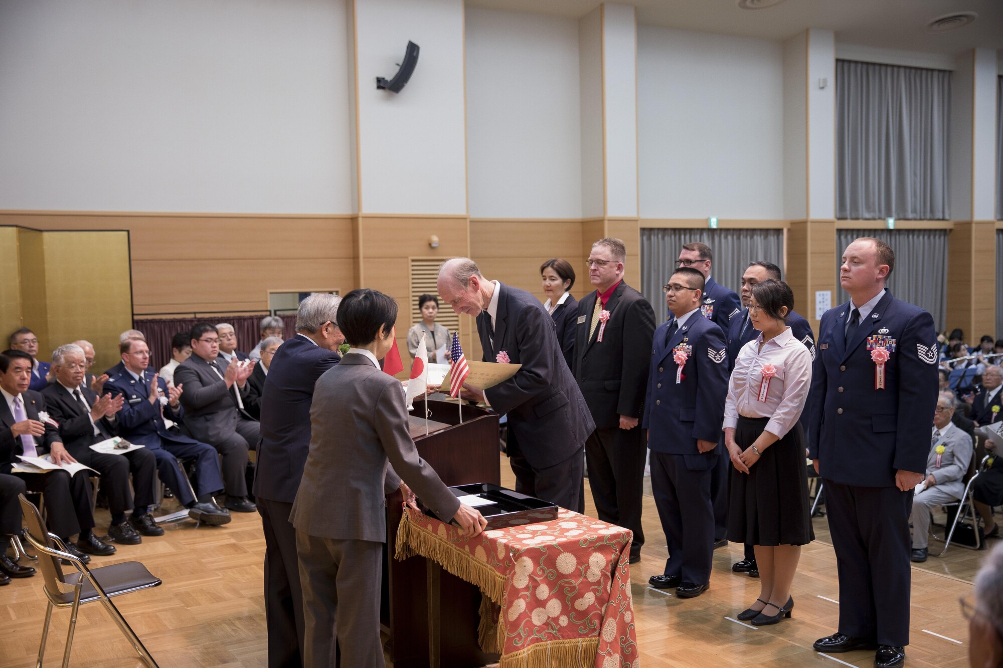 Paul Keenan, 374th Force Support Squadron director, accepts the Good Deed Award on behalf of Team Yokota during a ceremony, May 20, 2017, at the Meiji Shrine, Tokyo, Japan. The five groups from Yokota Air Base that received this year’s award included: the Yujo Community Center Outreach Program, D Flight Team, Kanto Plains Special Olympics, Yokota Air Base Knights of Columbus Council 15969 and a team from the 374th Logistics Readiness Squadron. (U.S. Air Force photo by Airman 1st Class Donald Hudson)