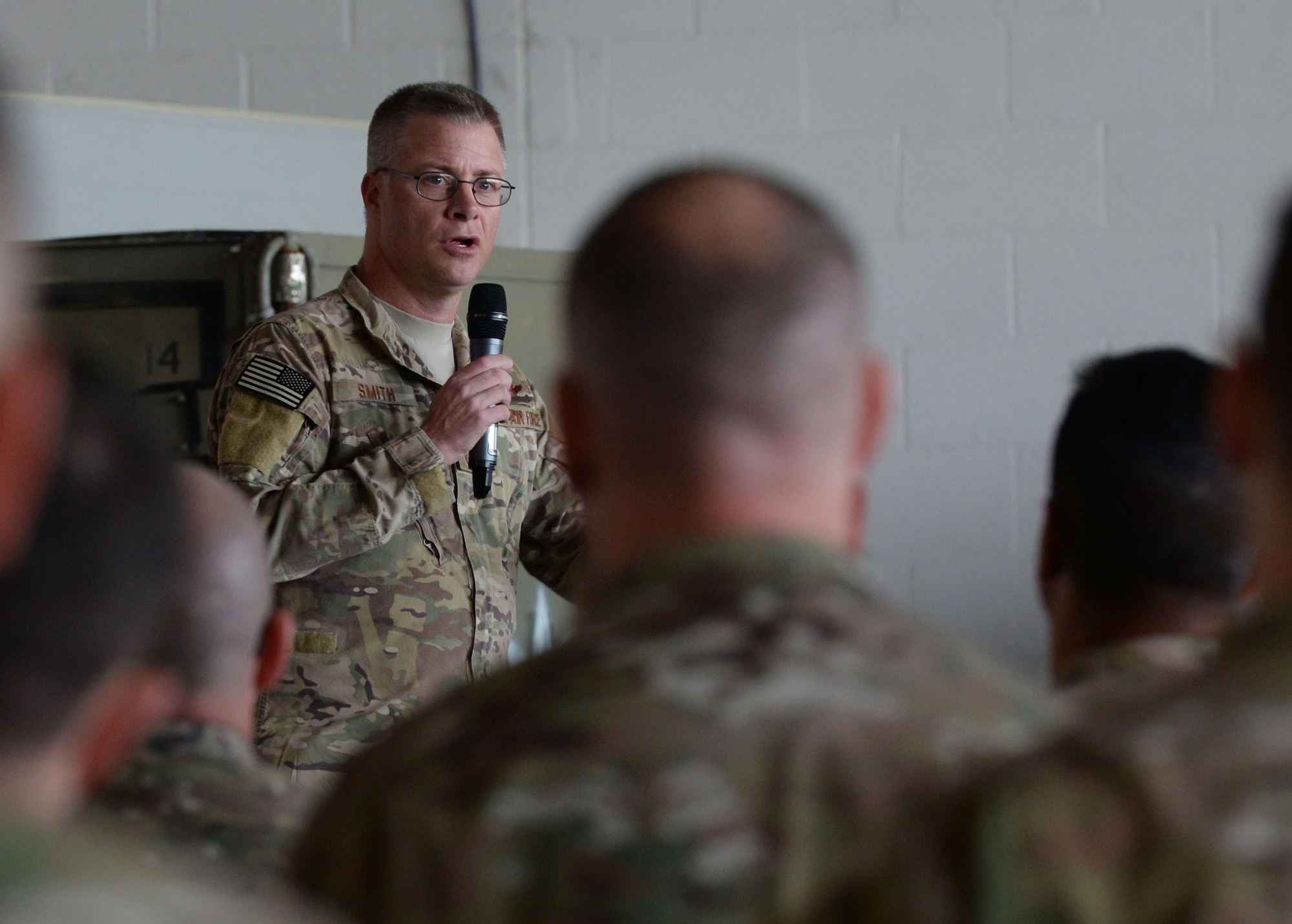 U.S. Air Force Chief Master Sgt. Gregory Smith, Command Chief Master Sergeant of Air Force Special Operations Command, speaks to Airmen assigned to the 352nd Special Operations Wing, May 24, 2017 during an all-call on RAF Mildenhall, England. Following the all-call, Smith visited various units within the wing to meet the Airmen and talk about their mission. (U.S. Air Force photo by Senior Airman Justine Rho)
