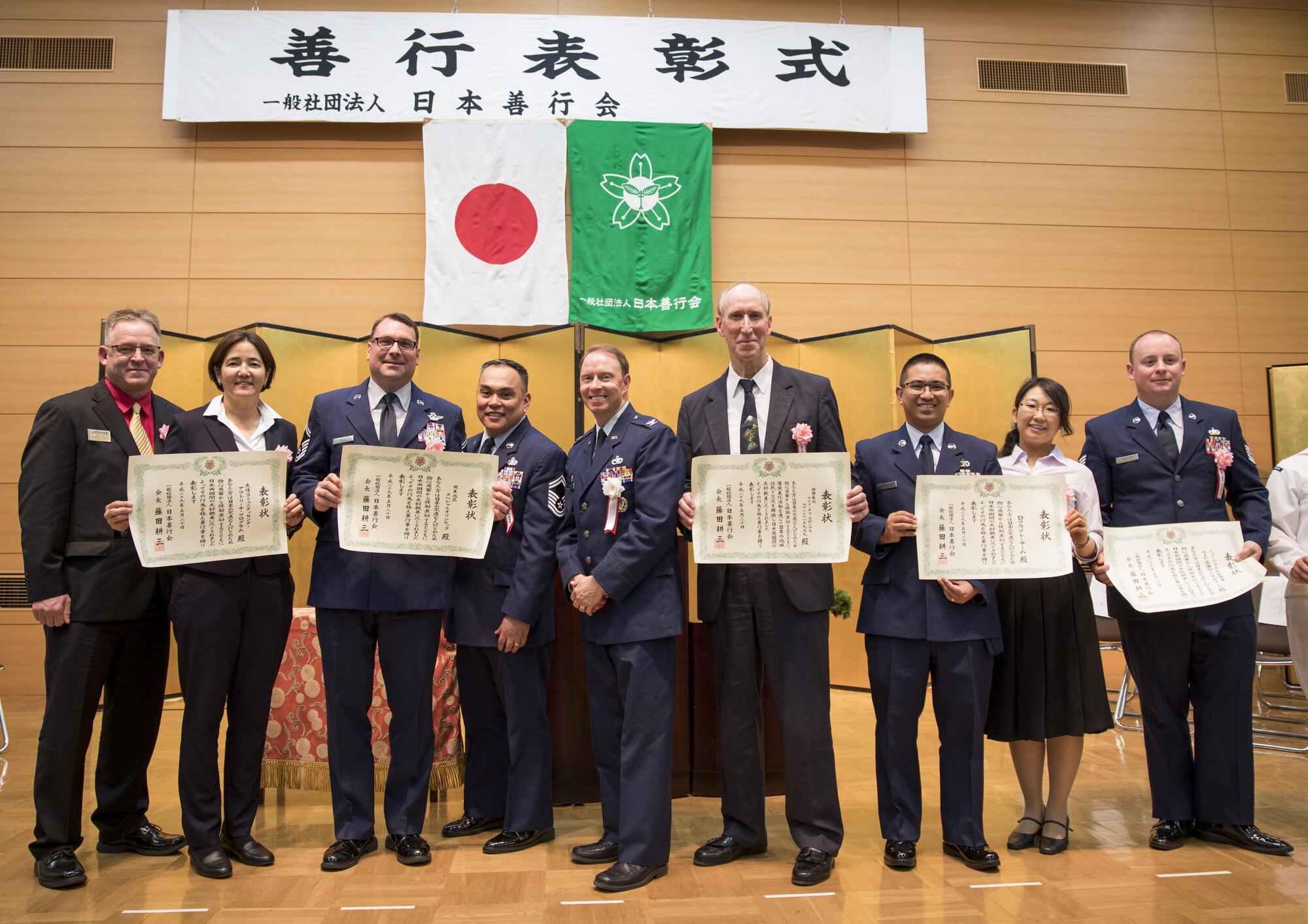 Yokota Air Base’s Good Deed Award recipients pose for a photo with Col. John Winkler, 374th Mission Support Group commander, May 20, 2017, at the Meiji Shrine, Tokyo, Japan. Since 2004, 55 groups and individuals from the 374th Airlift Wing have received the award. (U.S. Air Force photo by Airman 1st Class Donald Hudson)