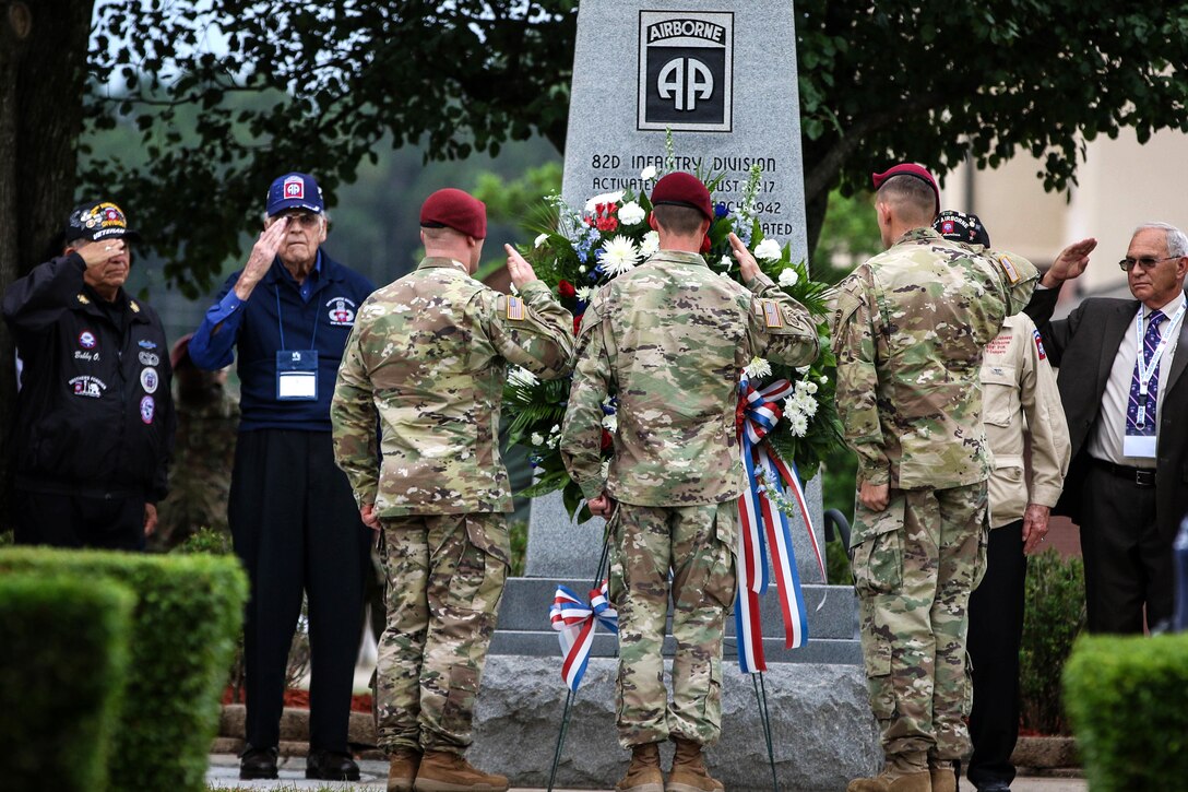 Paratroopers and veterans salute a wreath commemorating the lives of fallen paratroopers during the All American Week Memorial Service at the 82nd Airborne Division War Memorial Museum at Fort Bragg, N.C., May 24, 2017. Army photo by Sgt. Jessica Nassirian