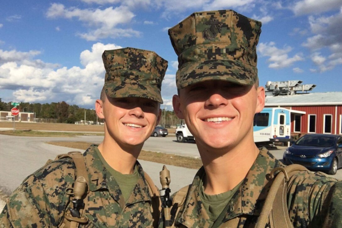 Marine Corps Pfc. Jason Gautreaux, left, and his brother, Marine Corps Lance Cpl. Mitch Gautreaux, take a picture together after training at the School of Infantry at Marine Corps Base Camp Geiger, N.C., Nov. 23, 2016. Both Marines will soon be assigned to units in close proximity to one another after graduating from Squadron Intelligence Training Certification Course. Jason will be assigned to Marine Light Attack Helicopter Squadron 267 at Marine Corps Base Camp Pendleton, Calif., and Mitch will be assigned to Marine Heavy Helicopter Squadron 465 at Marine Corps Air Station Miramar, Calif. Courtesy photo