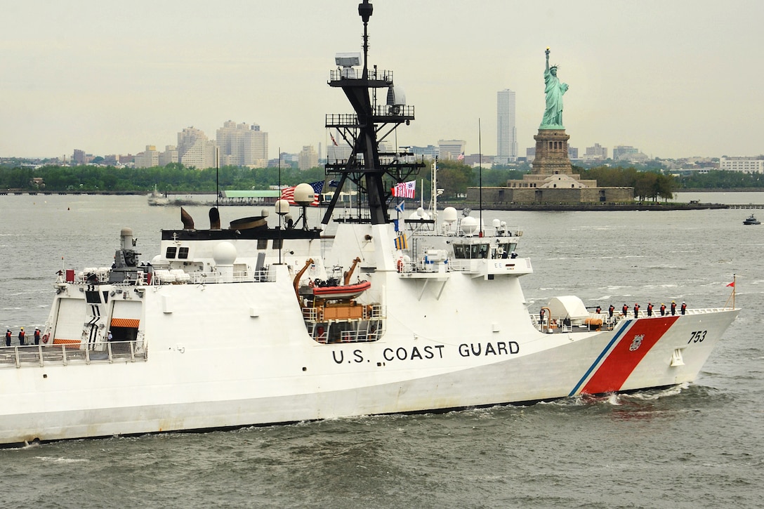 The USCGC Hamilton's crew renders honors as the ship approaches the Statue of Liberty during the parade of ships as part of Fleet Week New York in New York, May 24, 2017. Navy photo by Chief Travis Simmons