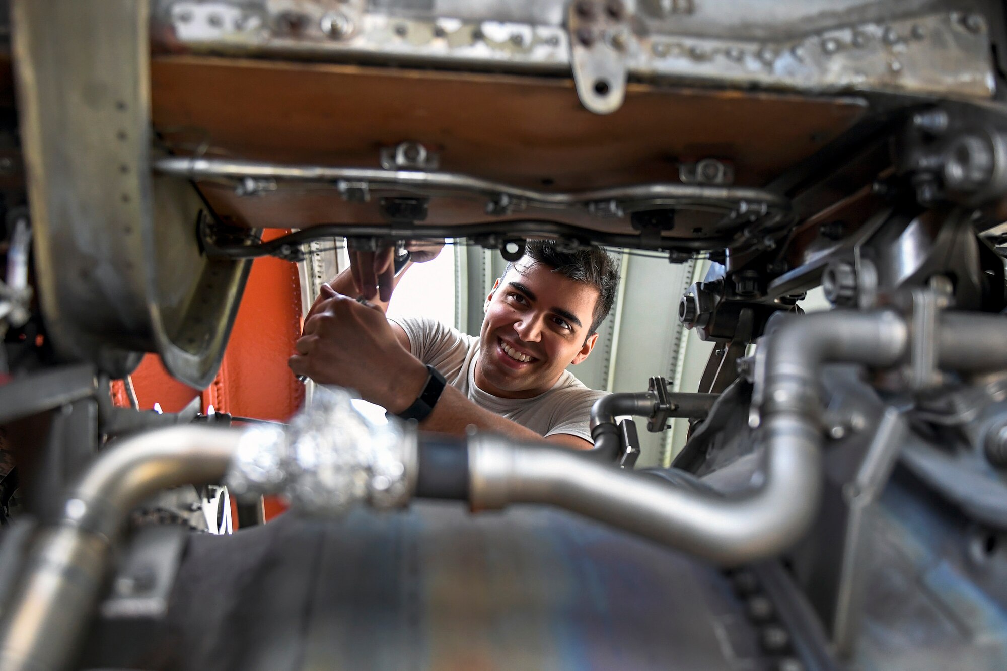 Senior Airman Eric Margoto performs maintenance on the tail engine of a KC-10 Extender at Joint Base McGuire-Dix-Lakehurst, New Jersey, May 24, 2017. Faulty fire detection systems in the tail engine were replaced. 
