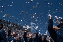 Class of 2017 Cadets are dismissed as the U.S. Air Force Thunderbirds in F-16 aircraft fly overhead during the U.S. Air Force Academy Graduation in Colorado Springs, Colo., May 24, 2017. The over 900 graduates will go on to serve as 2nd Lieutenants across the Air Force. 