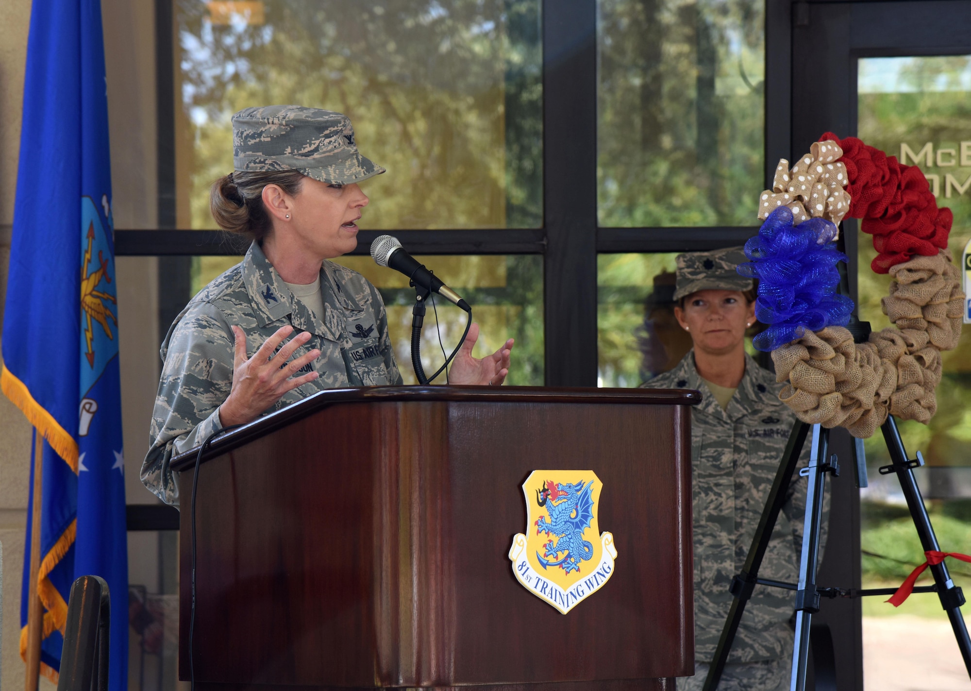 Col. Michele Edmondson, 81st Training Wing commander, delivers remarks during the McBride Commons Grand Opening ceremony May 16, 2017, on Keesler Air Force Base, Miss. The nine-month project transformed the former base library into a common area with a children’s library, computer stations, engraving, framing, marketing and print shops and a full kitchen for those with base access. (U.S. Air Force photo by Kemberly Groue)