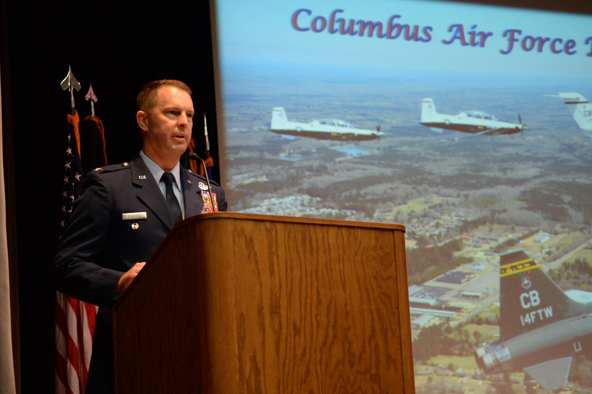 Col. Gregory Roberts, Chief, Standardization and Evaluation Division, A2/3/10 Directorate for Intelligence, Operations, and Nuclear Integration, Air Education and Training Command, Joint Base San Antonio – Randolph, Texas, speaks at the graduation of Specialized Undergraduate Pilot Training Class 17-09 May 19, 2017, on Columbus Air Force Base, Mississippi. Roberts emphasized the phrase, Prioritize, Aviate, Navigate and Communicate as the keys to success in flying and in life. (U.S. Air Force photo by Airman 1st Class Keith Holcomb)