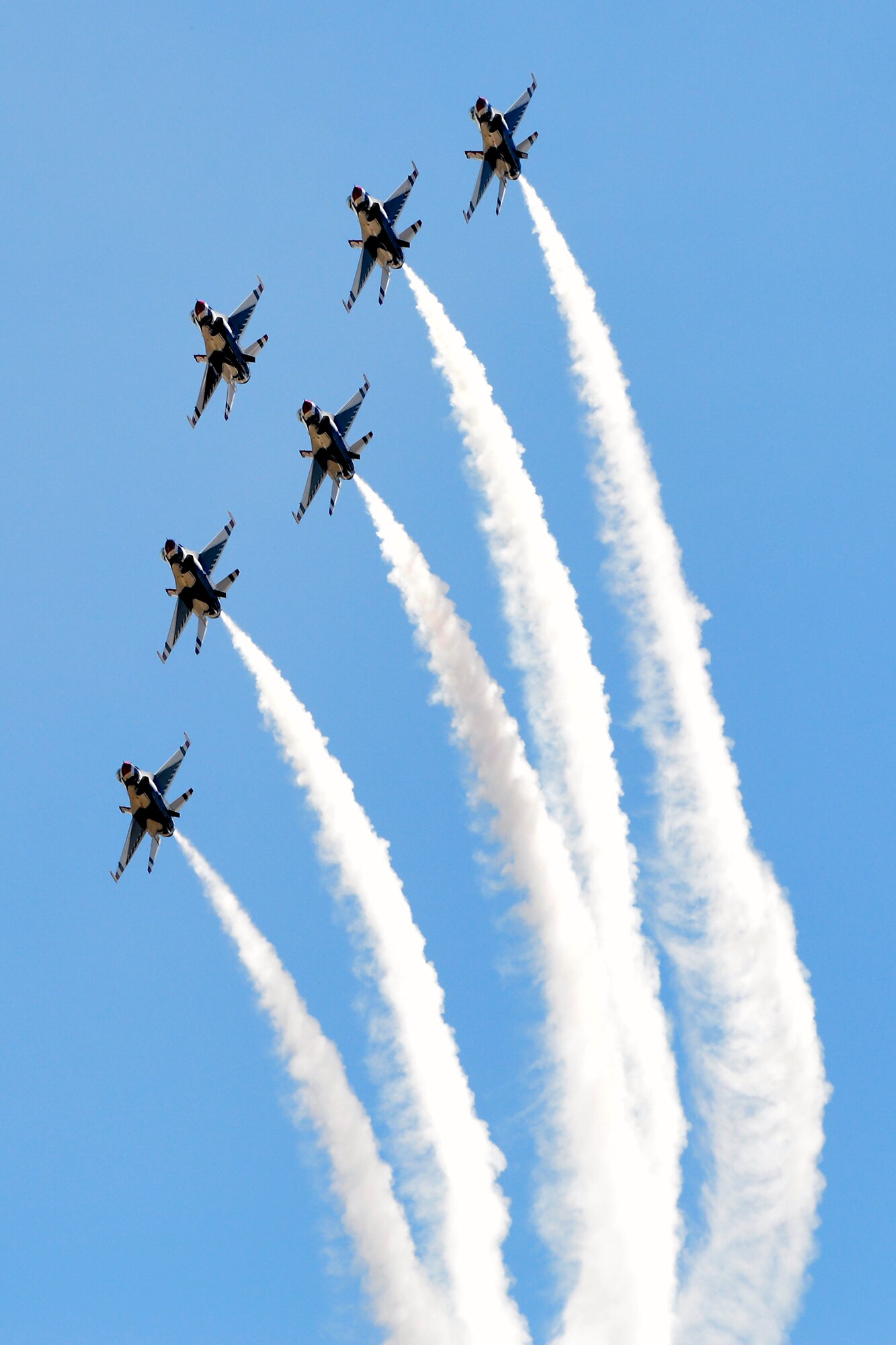 The U.S. Air Force Thunderbirds takes to the sky above Falcon Stadium, May 24, 2017, at the U.S. Air Force Academy. The Thunderbirds performed a 30-minute demonstration above the Academy after the Class of 2017's graduation ceremony. (U.S. Air Force photo/Bill Evans) 