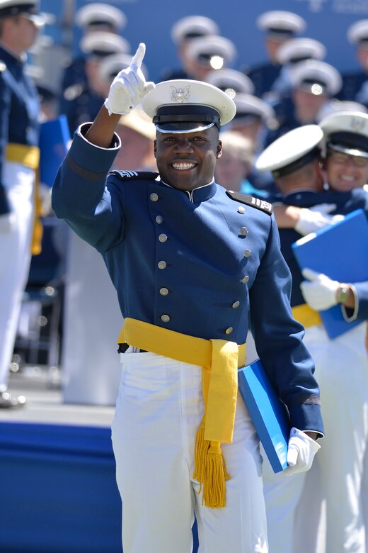 Newly-minted 2nd Lt. Haji Dunn points to the sky after receiving his diploma during the U.S. Air Force Academy's Class of 2017 graduation ceremony, May 24, 2017, in Falcon Stadium. (U.S. Air Force photo/Bill Evans)