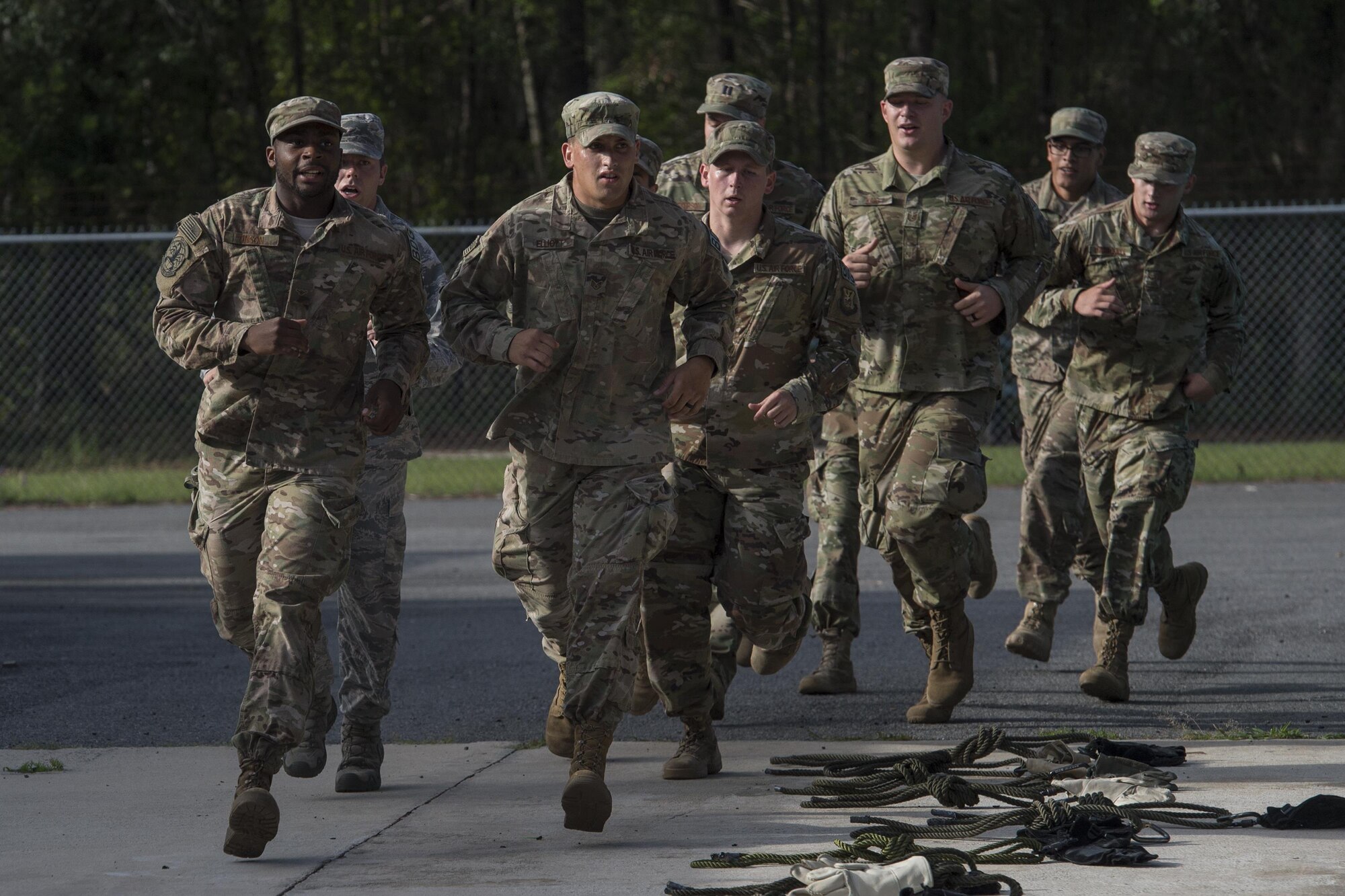 Army Air Assault candidates run a lap around a rappel tower during an Army Air Assault assessment, May 16, 2017, at Moody Air Force Base, Ga. Twenty-six Airmen attended the assessment which measured candidates’ aptitude in Air Assault operations, completion of equipment layouts, and rappelling. (U.S. Air Force photo by Tech. Sgt. Zachary Wolf)