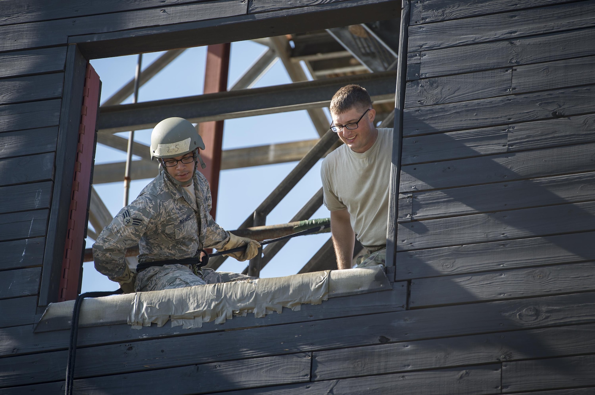 Senior Airman Steven Morales, 45th Security Forces patrolman from Patrick Air Force Base, Fla., prepares to rappel during an Army Air Assault assessment, May 17, 2017, at Moody Air Force Base, Ga. Twenty-six Airmen attended the assessment which measured candidates’ aptitude in Air Assault operations, completion of equipment layouts, and rappelling. (U.S. Air Force photo by Tech. Sgt. Zachary Wolf)