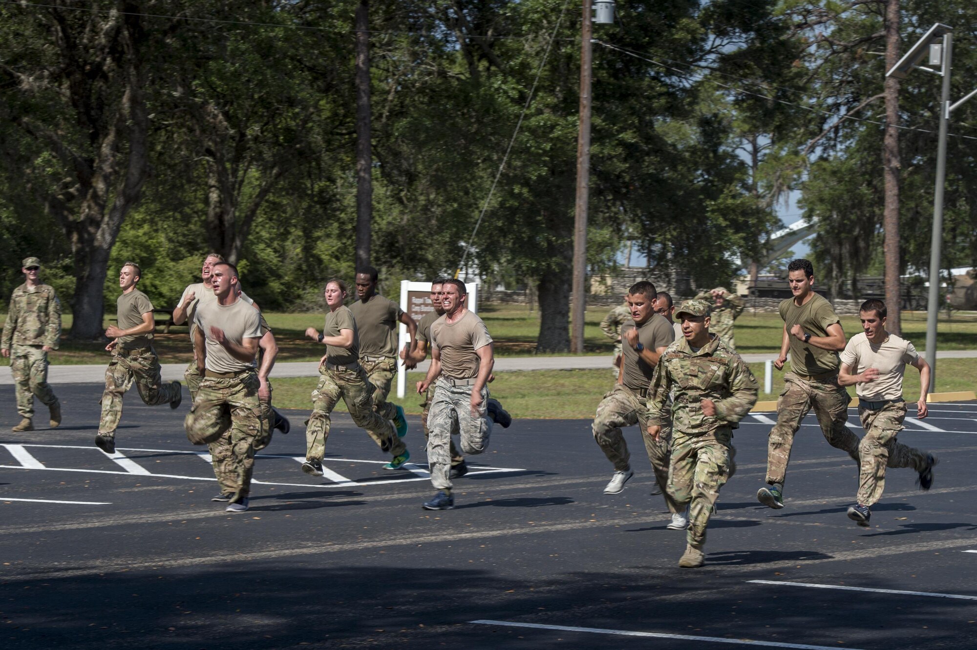 Army Air Assault candidates run during a calisthenics session at an Army Air Assault assessment, May 18, 2017, at Camp Blanding, Fla. Twenty-six Airmen attended the assessment which measured candidates’ aptitude in Air Assault operations, completion of equipment layouts, and rappelling. (U.S. Air Force photo by Tech. Sgt. Zachary Wolf)