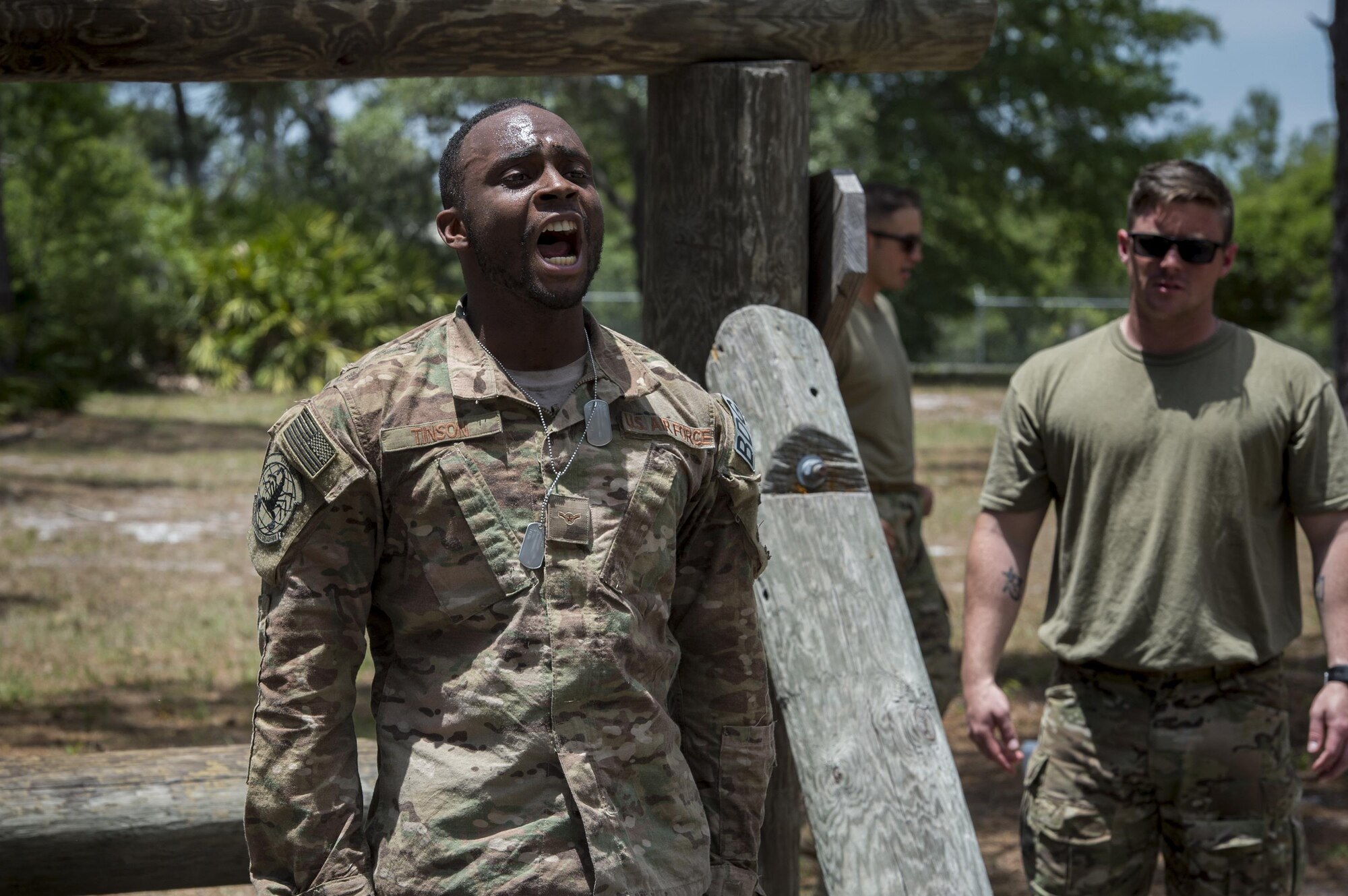 Airman Montrease Tinson, 822nd Base Defense Squadron fire team member, sounds-off after completing an obstacle during an Army Air Assault assessment, May 18, 2017, at Camp Blanding, Fla. Twenty-six Airmen attended the assessment which measured candidates’ aptitude in Air Assault operations, completion of equipment layouts, and rappelling. (U.S. Air Force photo by Tech. Sgt. Zachary Wolf)