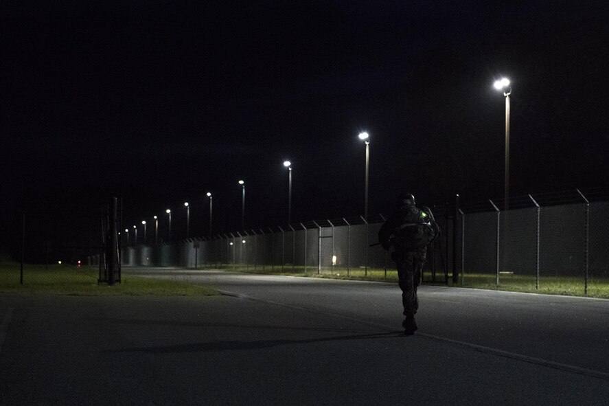 An Army Air Assault candidate walks during a 12-mile ruck march as part of an Army Air Assault assessment, May 19, 2017, at Moody Air Force Base, Ga. Twenty-six Airmen attended the assessment which measured candidates’ aptitude in Air Assault operations, completion of equipment layouts, and rappelling. (U.S. Air Force photo by Tech. Sgt. Zachary Wolf)