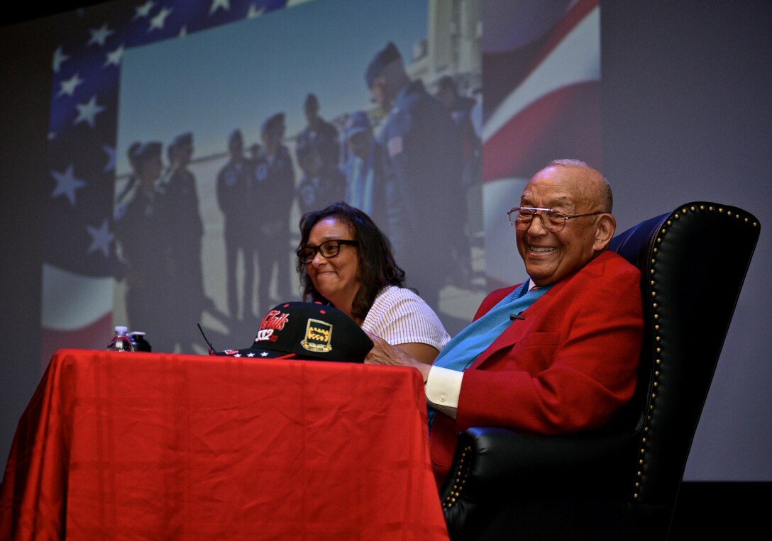 Tuskegee Airman, retired Lt. Col. Robert (Bob) J. Friend gives the audience a great smile as he finishes a presentation May 7, 2017 at the Scott Library Auditorium, Scott Air Force Base, Illinois. Seated with Friend is Karen Friend Crumlich, one of his daughters and assistant when he travels to various speaking engagements. (U.S. Air Force photo by Tech. Sgt. Christopher Parr)