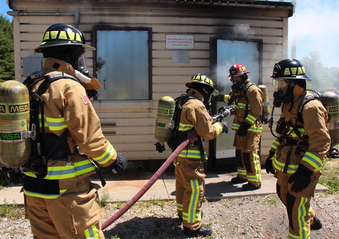 932nd Civil Engineering Squadron firefighters worked many additional hours beyond the normal drill weekend, concentrating in core job training on a special training weekend, upgrading their critical skills. Many are preparing to deploy later in the year. Here they prepare to go into a smoke-filled building to search for a possible victim.  First aid, accountability of all 32 Air Force Reserve Command members, safety briefings, along with oxygen and water management tactics were practiced May 20-21, 2017, at Scott Air Force Base, Illinois. (U.S. Air Force photo by Lt. Col. Stan Paregien)