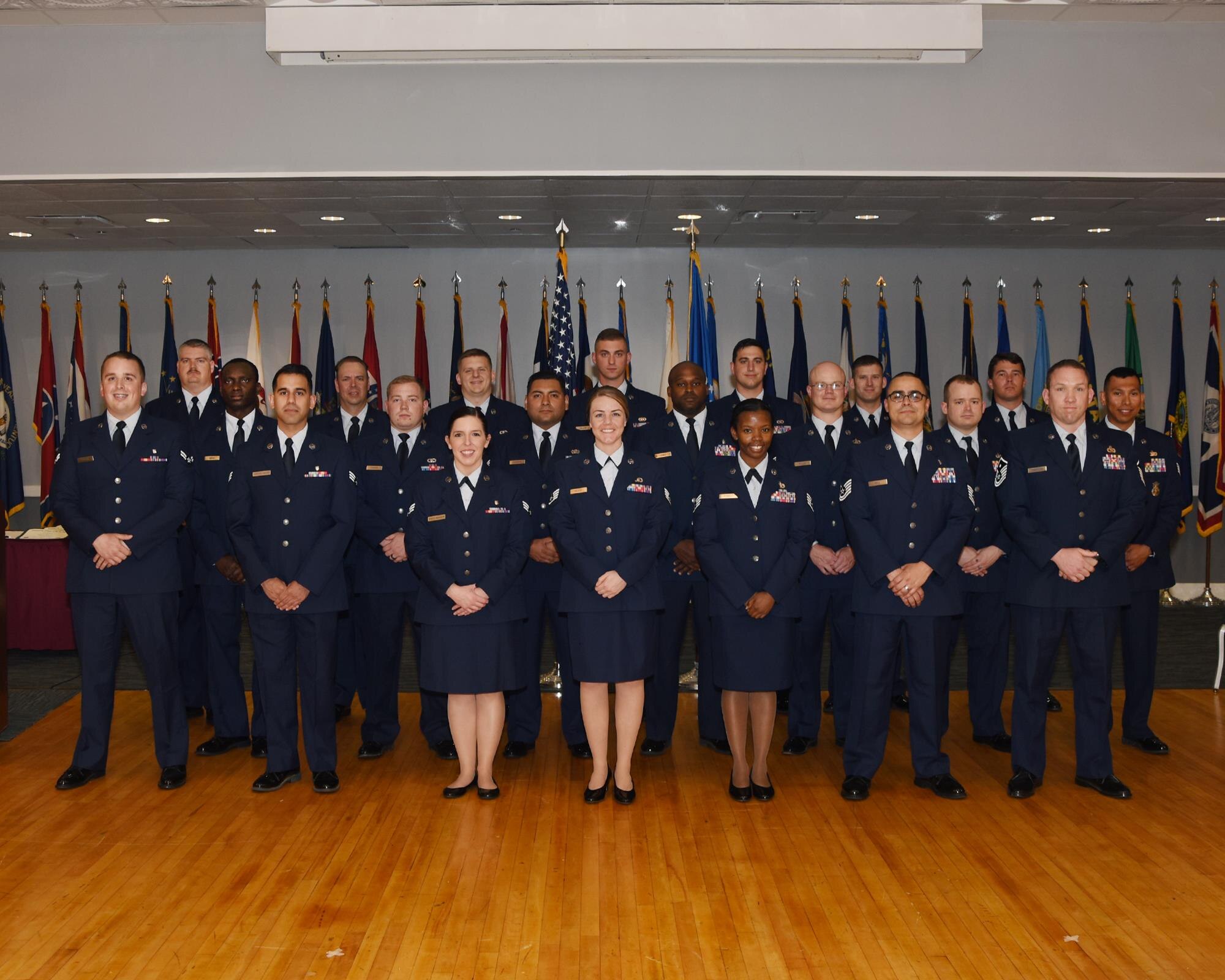 Twenty-one Columbus enlisted Airmen graduate from the Community College of the Air Force May 18, 2017, at Columbus Air Force Base, Mississippi. Each enlisted Airman has the opportunity to earn an associate’s degree that coincides with their career field, such as someone in Security Forces getting a criminal justice degree. (U.S. Air Force photo by Melissa Doublin)