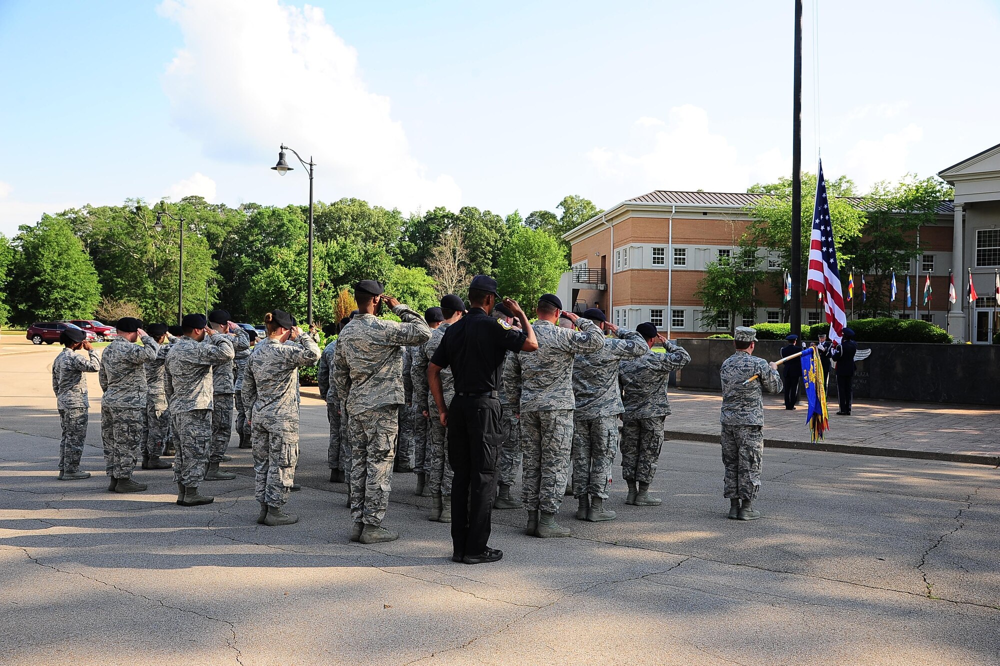The 14th Security Forces Squadron salutes the flag during a retreat ceremony May 19, 2017, at the Gene Smith Plaza on Columbus Air Force Base, Mississippi. The retreat ceremony was one of the lasts events of the 2017 Police Week. (U.S. Air Force photo by Airman 1st Class Beaux Hebert)
