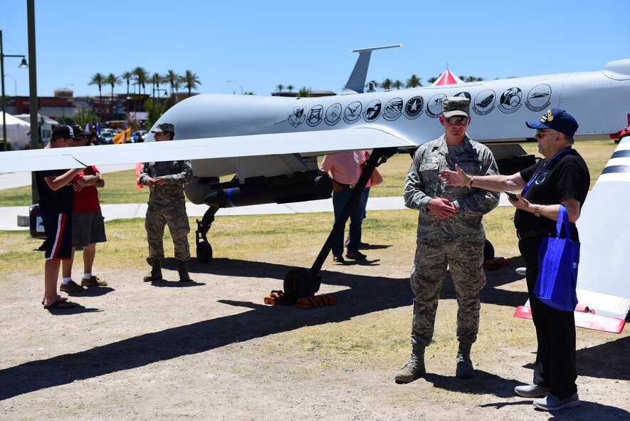 MQ-1 Predator maintainers explain the capabilities of their aircraft to veterans and their families during the American Patriot Festival May 20, 2017, in Las Vegas. The maintainers answered questions and provided information to showcase the Predator mission. (U.S. Air Force photo/Senior Airman Christian Clausen)
