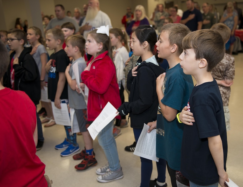 Children from Newfane Elementary School recite the pledge of allegiance during a military luncheon hosted by the students, May 24, 2017, community center, Newfane, N.Y. The luncheon was open to veterans and actively serving Military members. The children sang songs and played music, then went on to serve lunch to those in attendance. (U.S. Air Force photo by Tech. Sgt. Stephanie Sawyer) 