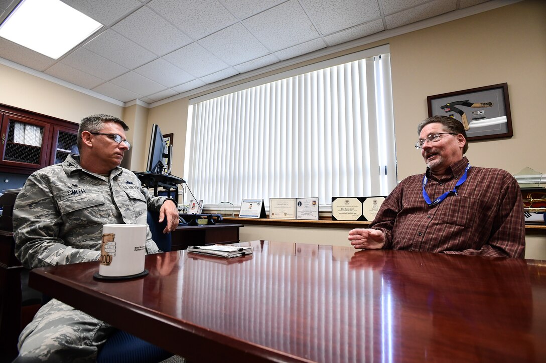 Wingman Advocate Andrew Kalinen talks with his host commander, Col. Paul Smith, about the 748th Supply Chain Management Group’s people issues. (U.S. Air Force photo/R. Nial Bradshaw)