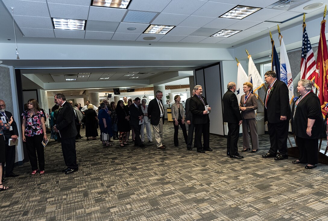 Ceremony attendees line up to offer their congratulations to members of the newly inducted 2017 DLA Land and Maritime Hall of Fame Class.