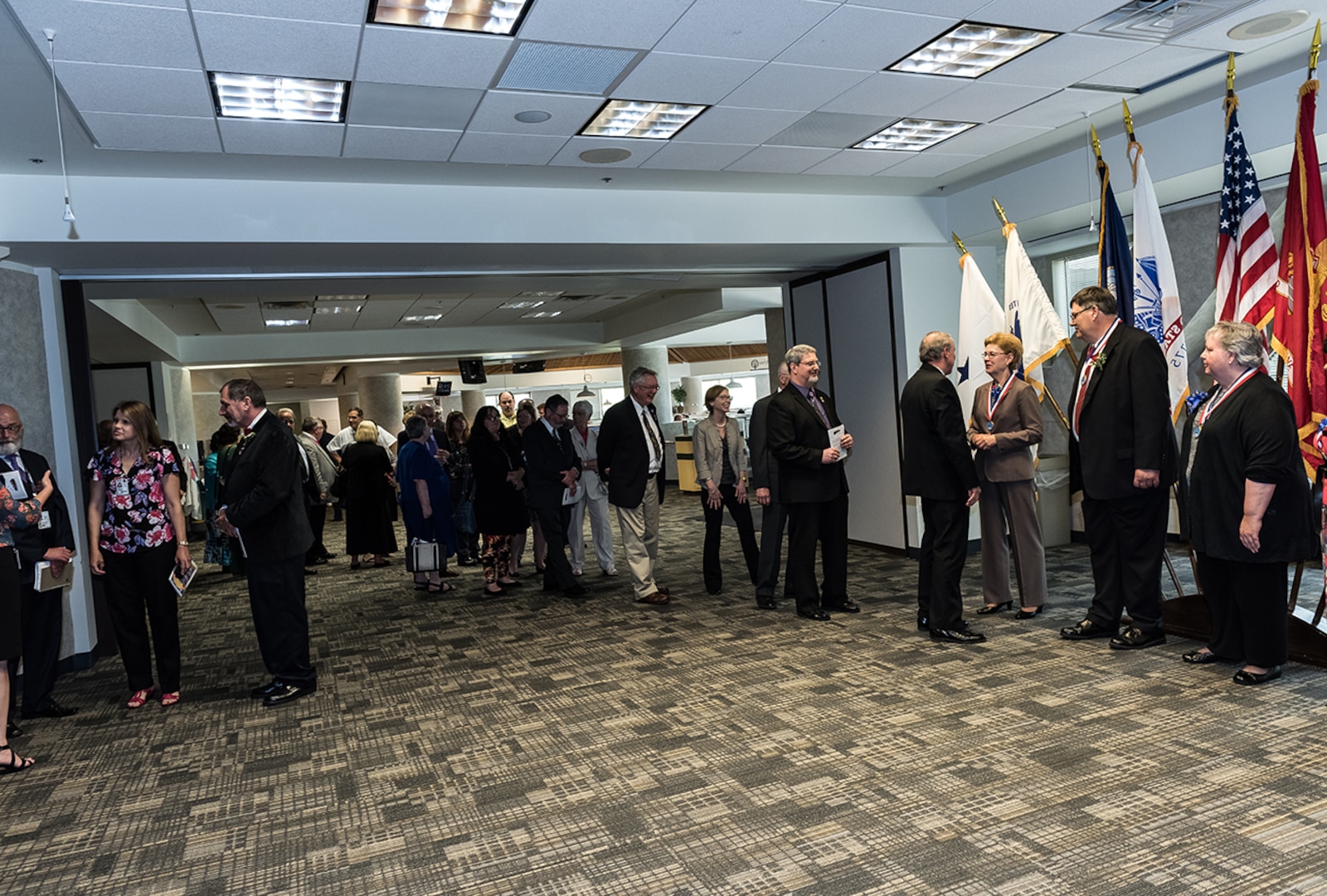 Ceremony attendees line up to offer their congratulations to members of the newly inducted 2017 DLA Land and Maritime Hall of Fame Class.